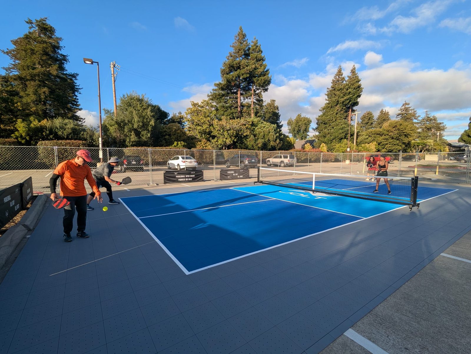Players rallying on a Jolt court