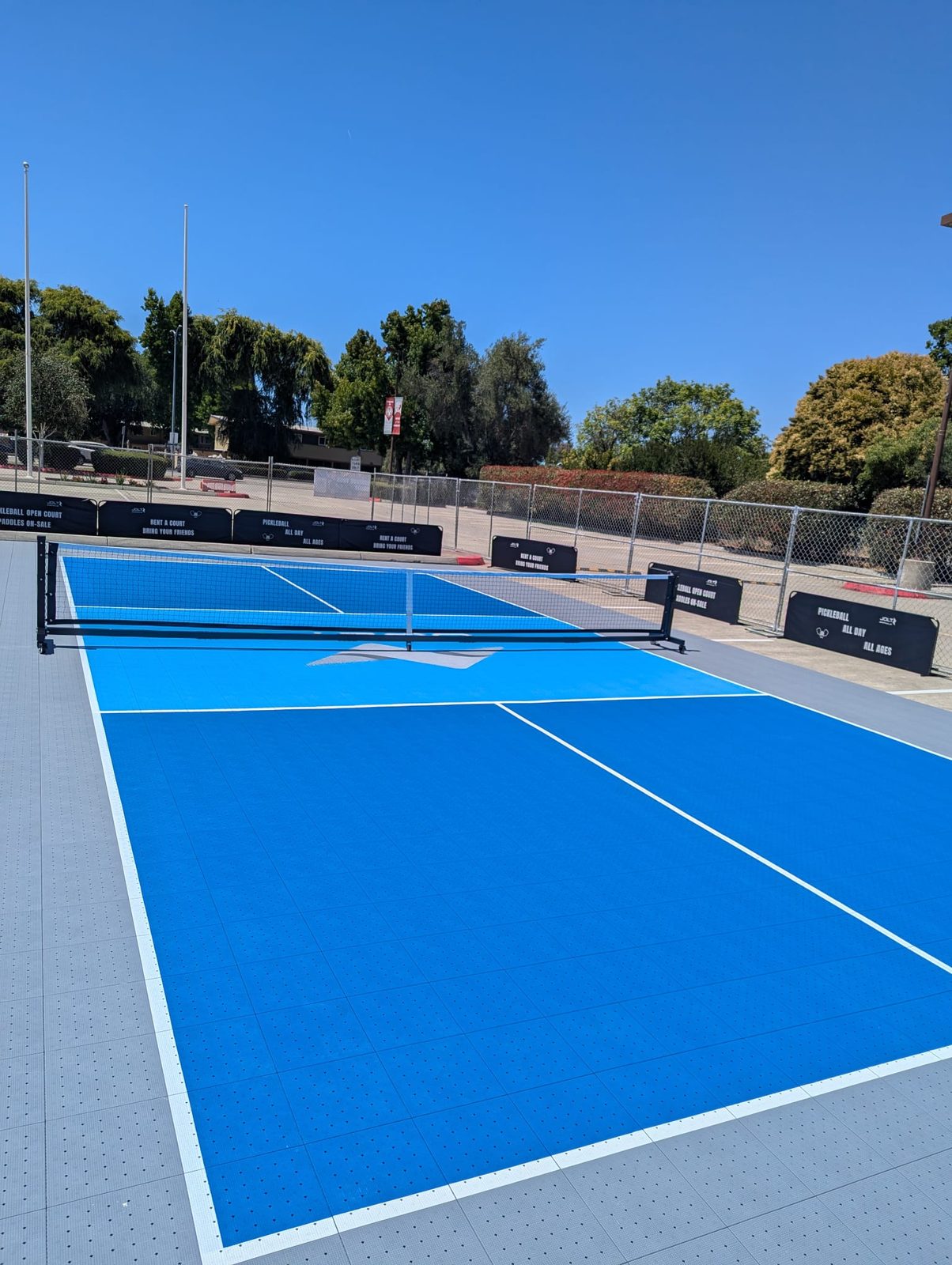 Finished Jolt-branded pickleball court, freshly installed